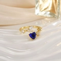 Close-up of gold open ring with blue heart gemstone and crystal leaf accents - Light Blue Heart Leaf Decor (JZ0152D)