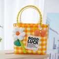 Pink and yellow woven picnic bag with plush flower and Good Luck label decoration - Sunflower Bow Decoration / Orange Yellow White