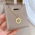 Detailed close-up of clover shell pendant necklace on soft velvet jewelry stand - Titanium Steel Style / Gold