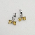 Bowknot earrings with yellow heart-shaped cubic zirconia and silver-tone snap closure - Silver Base With Yellow Zirconia
