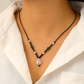 Pink star pendant necklace with white pearls and green beads on a black woven cord - Black Braided Cord Pink Star Beaded Necklace (6991)