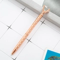 Rose gold diamond crystal ballpoint pen with white polka dots on a modern desk setup - Rose Gold with White Polka Dots