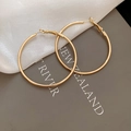 Macro detail of gold hoop earrings with leverback closure on elegant silk fabric - 5cm / Gold