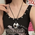 Detailed view of a vintage ceramic necklace with silver metal and brown stone on a black cord - Coffee Round Pendant Necklace X4642D