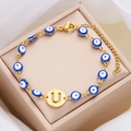 Gold stainless steel evil eye charm bracelet with a cutout letter U pendant and clasp - Letter U