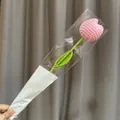 Handmade pink crochet tulip flower in clear film packaging with white card accent - Pink Tulip