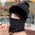 Detail showing women's black knitted winter hat and neck gaiter set with faux fur trim - Pineapple Pom Pom / Black