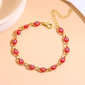 Detail of evil eye bracelet with red beads, golden links and adjustable extender chain - Red Gold