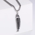 Detailed close-up of a vintage fish bone pendant in stainless steel on a silver box chain - Steel Color (No Chain)