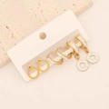 Detailed view of three pairs of gold-plated earrings with pavé crystals on a card - Round Rhinestone (4# Round)