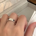 Silver hollow heart-shaped open ring with small black gemstone on model hand - Heart Hollow Rhinestone Ring (J4173)