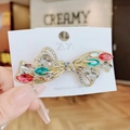 Elegant gold butterfly hair clip with colorful crystals on a handmade jewelry card - Butterfly Knot Multicolor Spring Clip