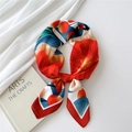 Elegant silk scarf featuring red fruit and blue leaf prints on a satin red fabric - Red Fruit Flower