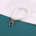 White glass pearl handbag chain with gold lobster clasp on artistic paper background - Pure White Pearl 24cm Long KC Buckle