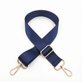 Detail of navy blue nylon bag strap with polished gold-tone metal hooks and adjustable buckle - Dark Blue