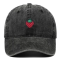 Washed black cotton baseball cap featuring a detailed red strawberry embroidery on front - Adjustable / Black