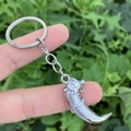 Vintage silver wolf tooth keychain with dragon head carvings and detailed scale textures - Dragon Head Ornament Horn Style (款1)