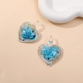 Detailed view of glass heart pendants featuring blue 3D flower motifs and top bail loops - Lake Blue (Type C)