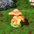 Miniature red mushroom resin ornament with white dots on a green mossy base - Style E (Red)