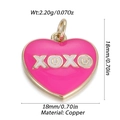 Macro detail of a pink heart charm made of copper with XOXO text and a metal loop - Pink XOXO Heart