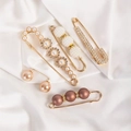 Detailed set of elegant faux pearl and crystal brooches on white silk fabric background - No. 5 Brown 5-Piece Set