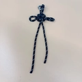 Handmade black and white braided paracord knot keychain accessory with silver D-ring buckle - Black
