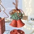 Vintage red Christmas bells with golden star relief, holly leaves and a gold bow pendant - Bell