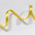 Detail of bright yellow satin ribbon with smooth finish for gift wrapping and DIY crafts - Thin Golden Yellow (1cm Width 5m Length)
