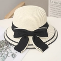 Elegant beige straw sun hat with black ribbon bow and wide brim for summer beach outings - One Size / White