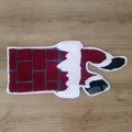 Detail of plush Christmas Santa chimney rug with non-slip texture on wooden floor - Christmas Style 9
