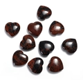 Macro shot of ten polished heart-shaped gemstones with deep reddish-brown patterns - Mahogany Obsidian