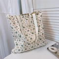 Close-up of floral cotton tote bag featuring blue and orange patterns on cream fabric - Yellow Green Ditsy Floral