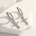 Silver cross hoop earrings with sparkling cubic zirconia on white stone pedestal - Silver Cross Huggie