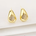 Detailed view of gold teardrop earrings with pavé clover design and zircon inlay - White