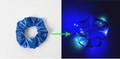 Blue LED glowing silk hair scrunchie shown in daylight and nighttime lighting contrast - Lighted-Royal Blue