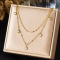Elegant gold double layer necklace with clear round crystal pendants on display - Double Layer Flat Chain with Five Bezel Diamonds Style (N4096)
