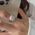 Chic silver lava style open ring featuring a lustrous baroque pearl on a female finger - Forest Full Moon Ring