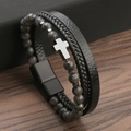 Detailed view of multilayer leather bracelet with natural stones and silver cross charm - Black+Labradorite