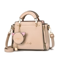 Detail view of beige faux leather tote bag with golden hardware and cat coin purse - Khaki