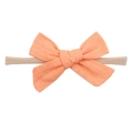 Elastic baby headband featuring a soft knit orange bow on a beige stretchy nylon band - Orange (27)
