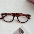 Retro leopard print frame sunglasses with silver heart-shaped rivets and oval lenses - Leopard / Clear Lens