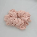 Macro shot of single light pink chiffon scrunchie showing soft pleated fabric texture - Pink (6-8)