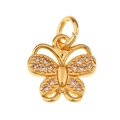 Detail of a golden butterfly pendant with white rhinestones on a white background - Butterfly