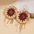 Detail of gold circular earrings with red woven cord and hanging metallic tassels - Ear Hook-Red