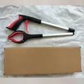 Foldable aluminum trash picker tool with red and black handle and cardboard box - Box Packaging / Red