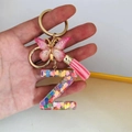 Detail of resin letter Z keychain with pink butterfly, tassel and colorful heart sequins - Butterfly Tassel 8-Shape Buckle / Letter Z