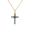 Macro detail of 18K gold-plated cross pendant with micro-set blue stones and reflection - Blue