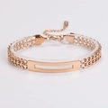 Close-up of rose gold stainless steel link chain bracelet with engravable metal plate - Rose Gold