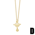 Elegant gold Saturn pendant necklace with sparkling zircons and a polished gold bead drop - Saturn Orb