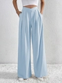 Detail showing the light blue high-waisted pleated trousers with cross-waist design - S / Light Blue